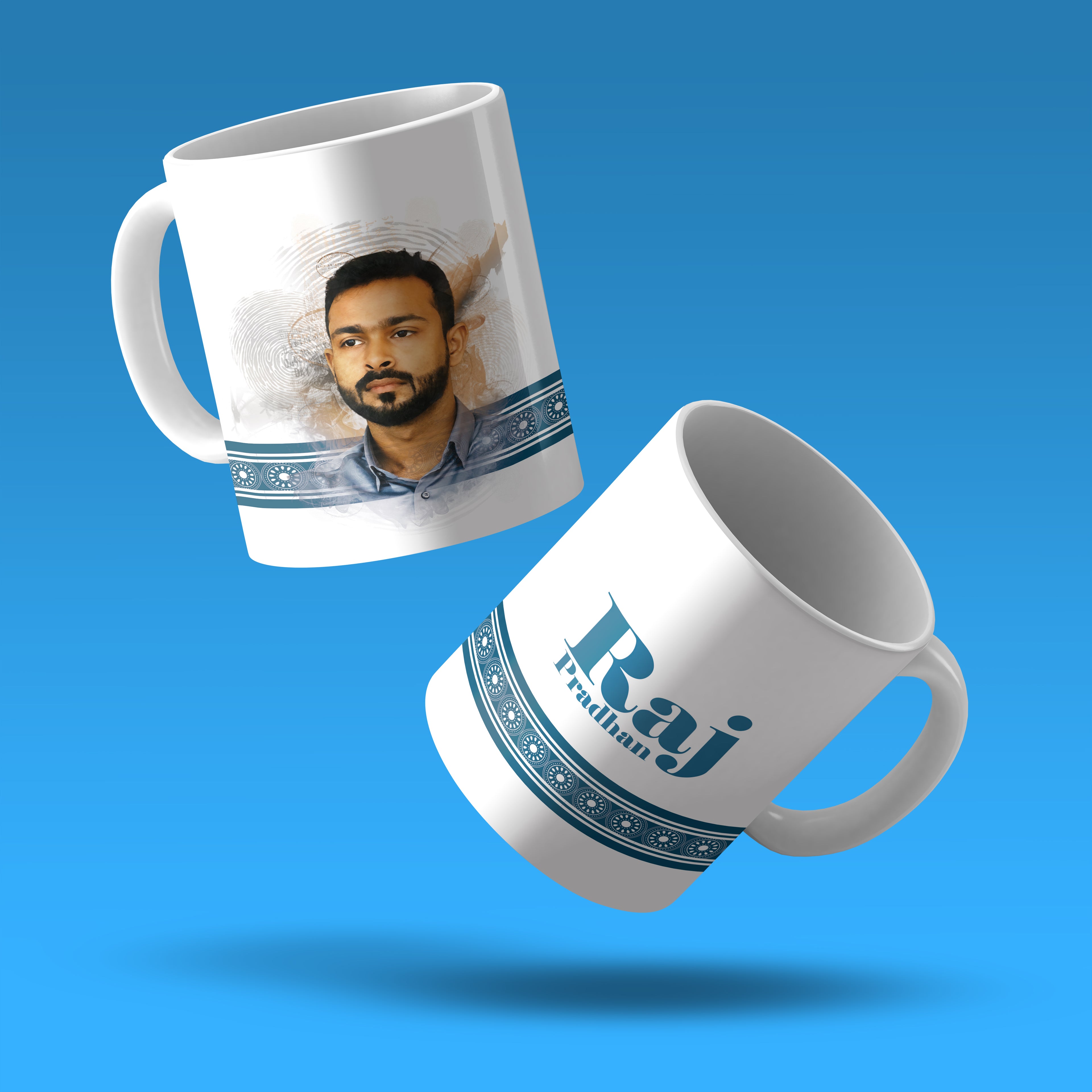 Two white Custom Printed Coffee Mug | 11 oz | White Ceramic Mugs float on a blue background—one shows a painted man's portrait above a blue pattern, the other reads "Raj Pratham" in bold blue, highlighting personalized mug design.
