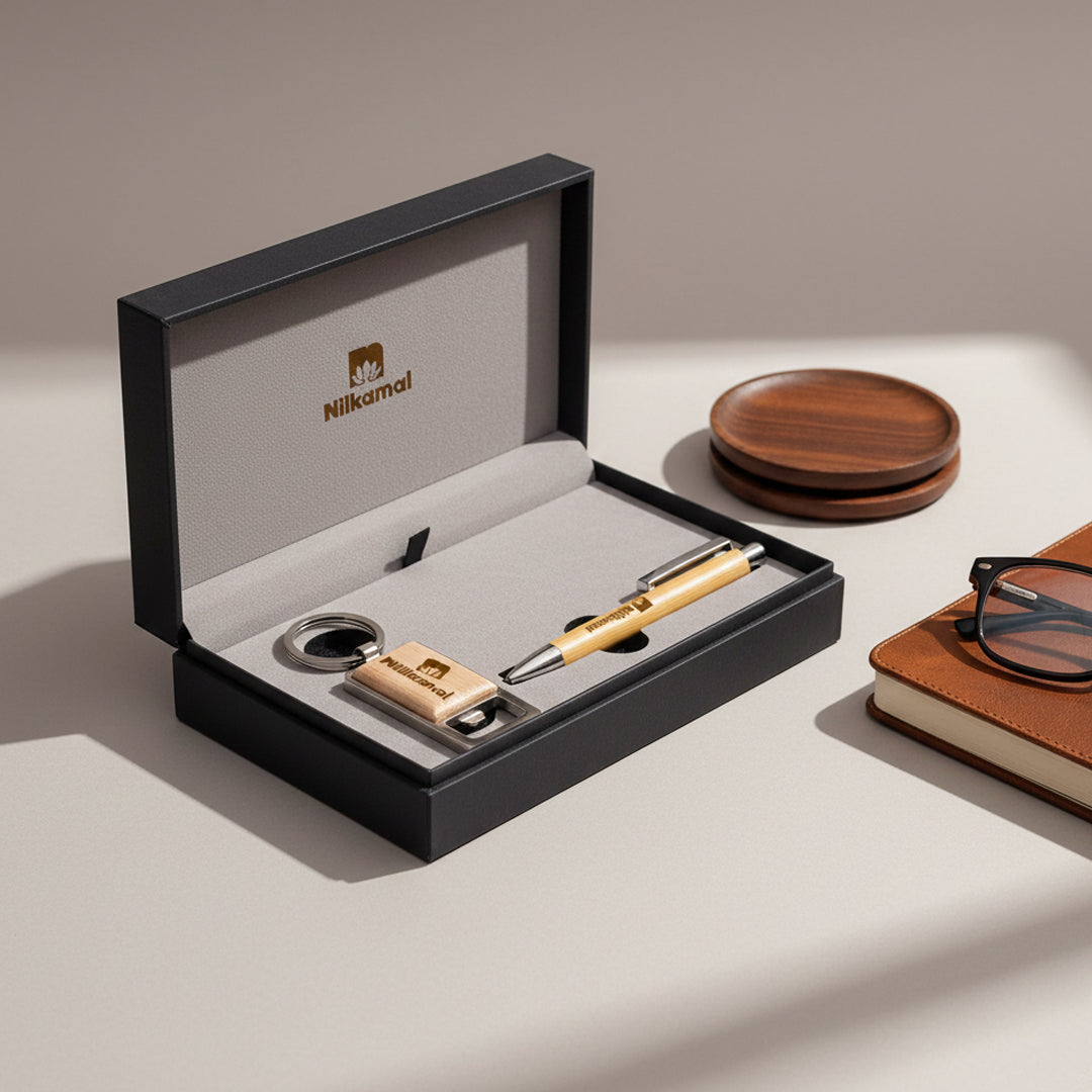 The Pen & Key Chain - Combo Gift Set - AIGS - 2503 includes a wooden pen, keychain, and USB drive with matching accents—ideal for corporate gifts. Shown next to a leather notebook, glasses, and wooden coasters on a light surface.