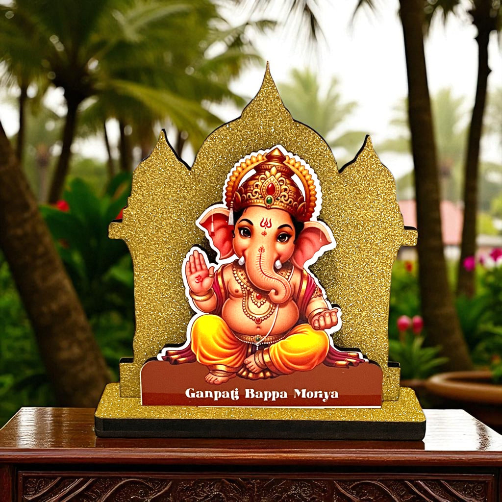 The Hindu Gods Mini Temple features a decorative Lord Ganesha idol with a golden glittery frame, perfect for your car dashboard. “Ganpati Bappa Morya” is inscribed, set against a backdrop of greenery and palm trees.