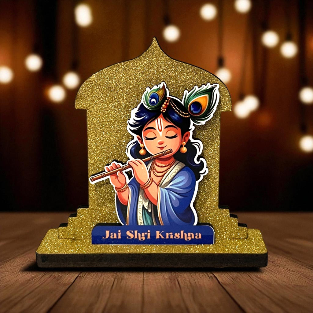 The Hindu Gods Mini Temple features Lord Krishna playing a flute, adorned with peacock feathers and set against a gold arch. "Jai Shri Krishna" is inscribed on the base, making it ideal for a miniature temple or car dashboard.