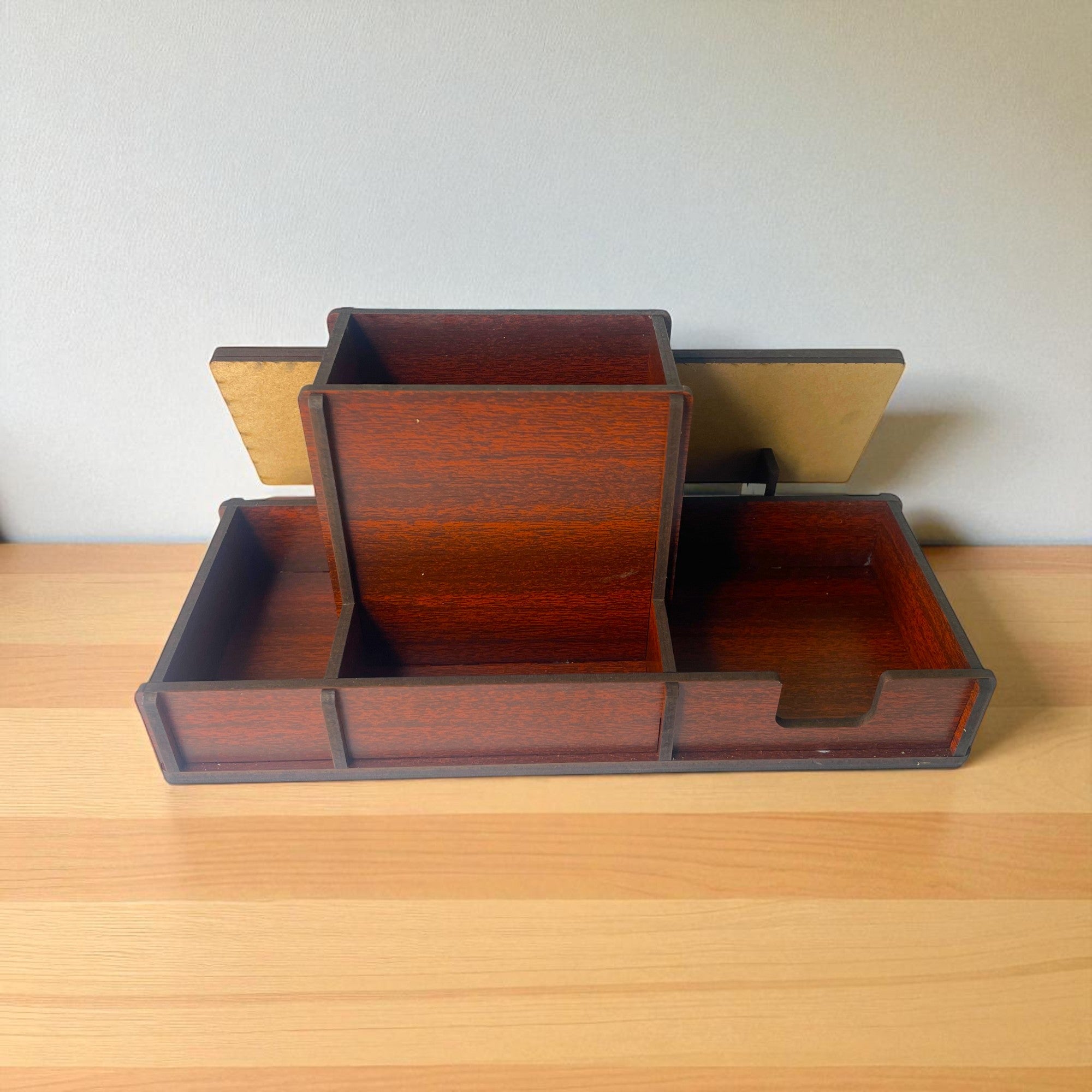 A Premium Wooden Desk Name Plate with Pen Holder, customized for office tables, sits stylishly on a light wood surface against a plain wall—an ideal corporate gift.